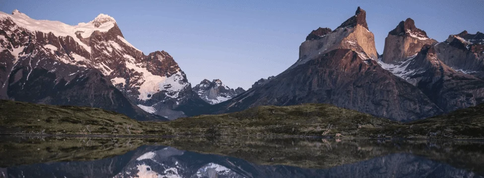 The Paine massif mirrored in still water at last light